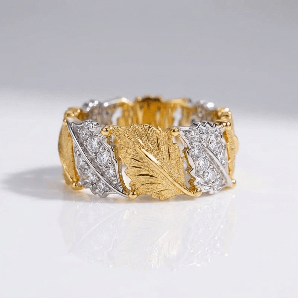 Ring i guld och silver med lövpavé – justerbar