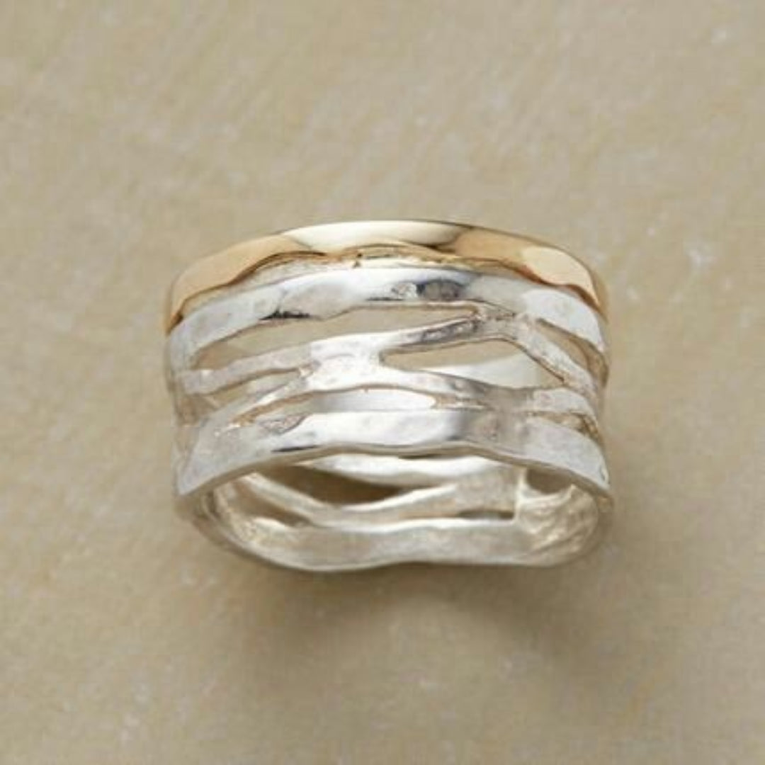 Genombruten vintagering i guld och silver