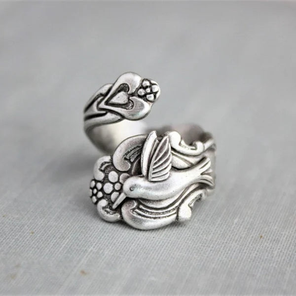 Ring med kolibri och blomma