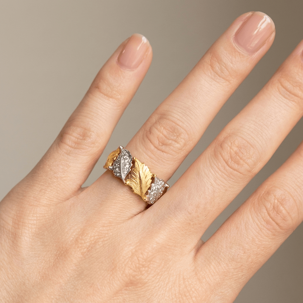 Ring i guld och silver med lövpavé – justerbar