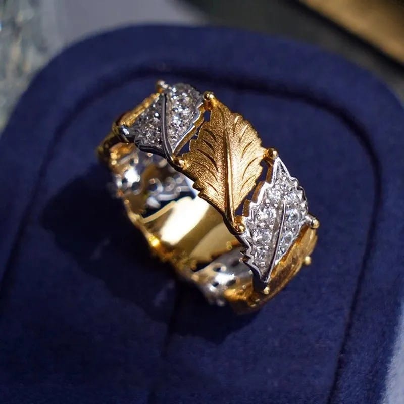 Ring i guld och silver med lövpavé – justerbar