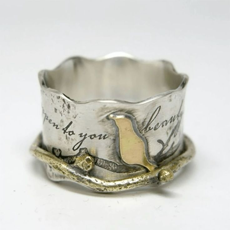 Silverring i vintagestil med gyllene fågel