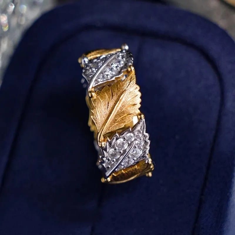 Ring i guld och silver med lövpavé – justerbar