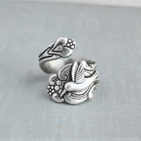 Ring med kolibri och blomma